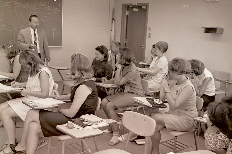 Students listen to a lecture from Professor of Classics Stephen L. Glass