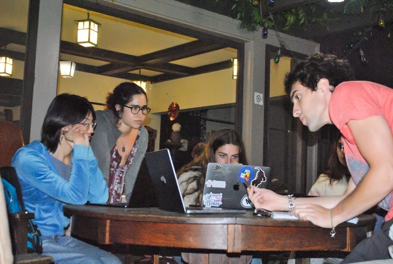 Willa Umansky and Outback creative director Rhyus Goldman work with other students on The Outback
