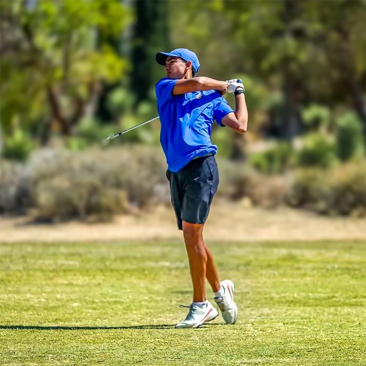 A Pomona-Pitzer men's golf player tees off