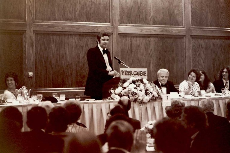robert atwell delivers a speech at a podium