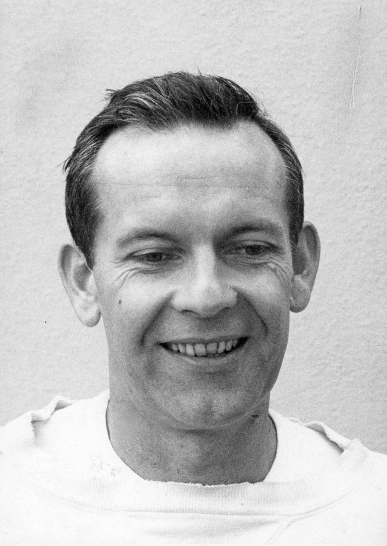black and white portrait of a man with short brown hair