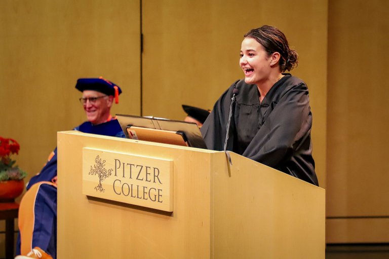 Elle Hale talks at a podium