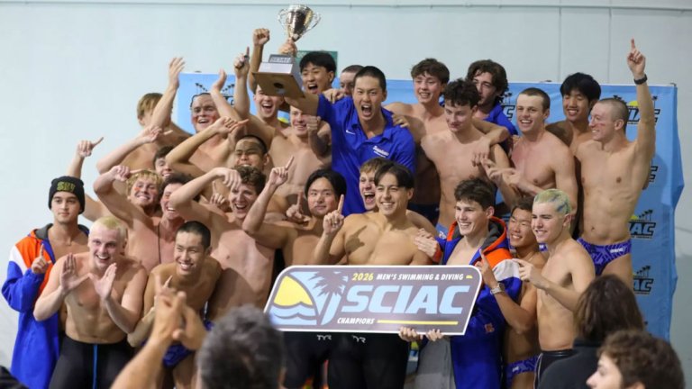 the men's swim and dive team pose with a SCIAC championship sign