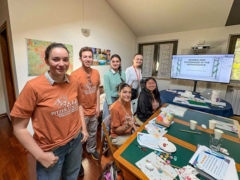 a group in a classroom behind a work desk