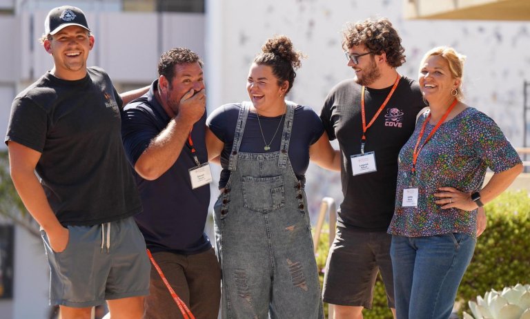 a family laugh together at family orientation