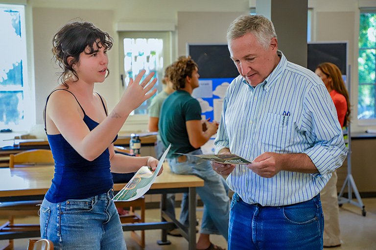 A student gives a trustee a tour of the Robert Redford Conservancy