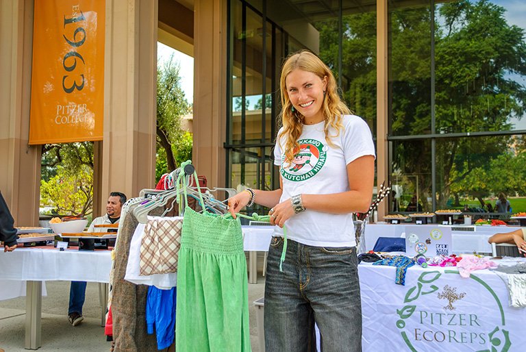 A student sells used clothes at the Pitzer EcoReps Sustainability Fair