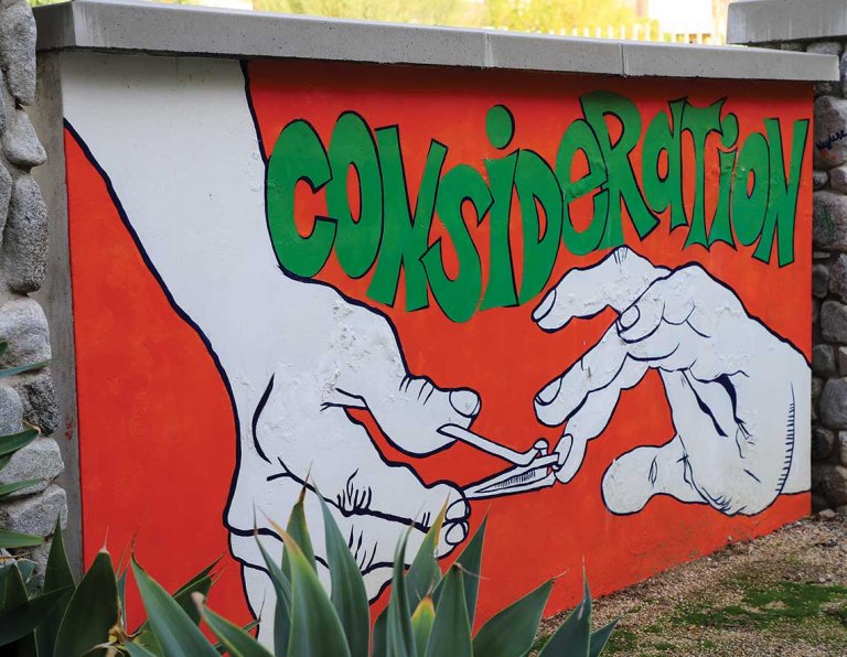 a mural of a hand clipping the nails of another hand and the word "Consideration" above them