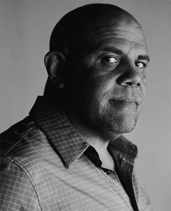 black and white headshot of Steven Thrasher