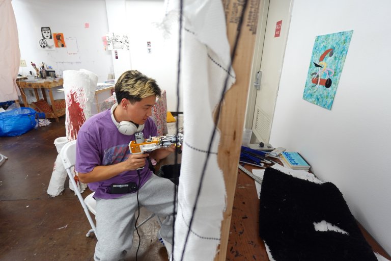 Male artist working on artwork