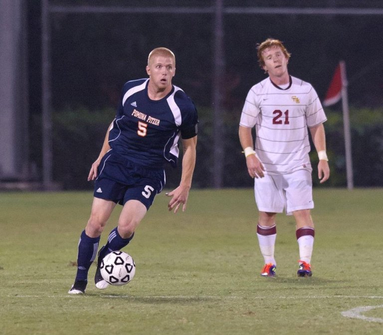 two athletes on the soccer field