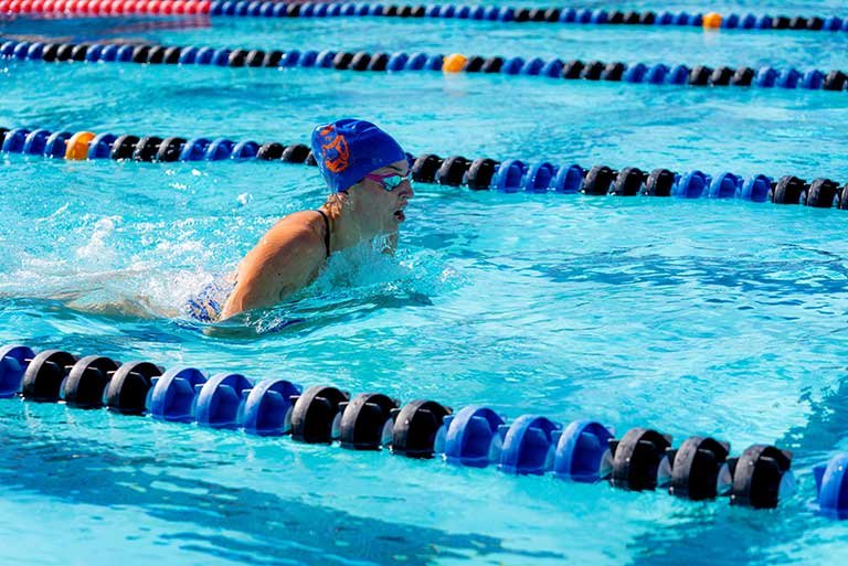 Nina Aballea swims in a pool lane