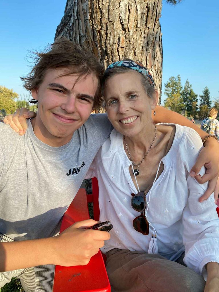 Noah Straus poses with his mom on the Mounds