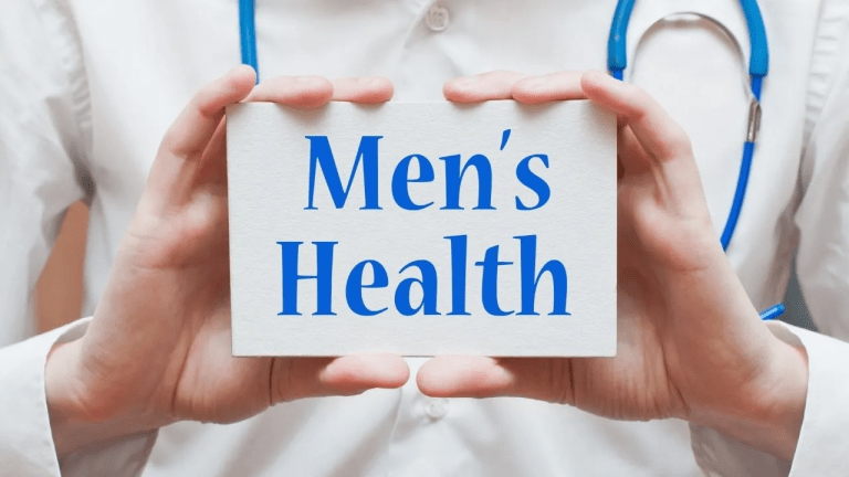 Doctor holding a sign that says men's health