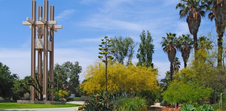 a view of the clock tower and the path leading up to the grove house