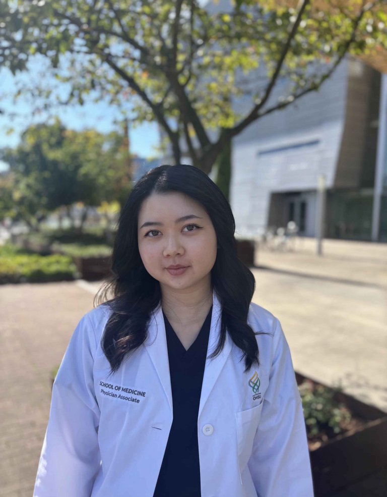 Jessica Choi poses in her white coat