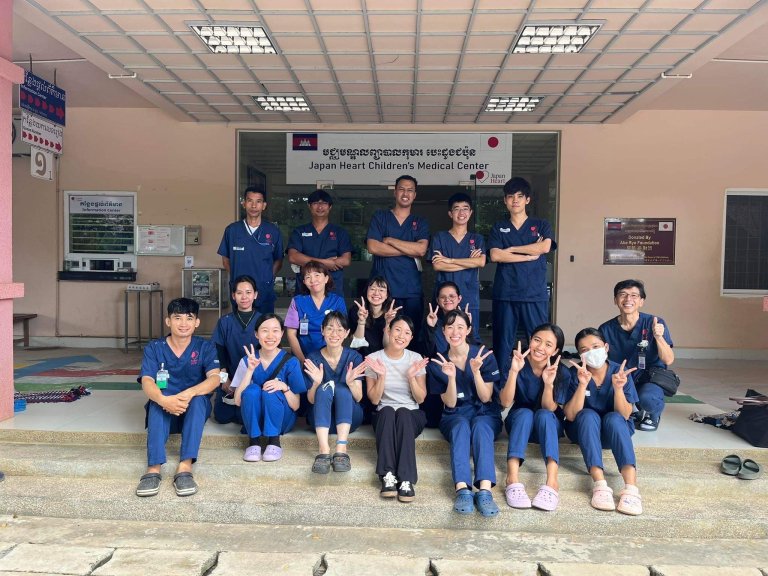 Mao Kobayashi sits on the sets of a Japanese hospital with the staff
