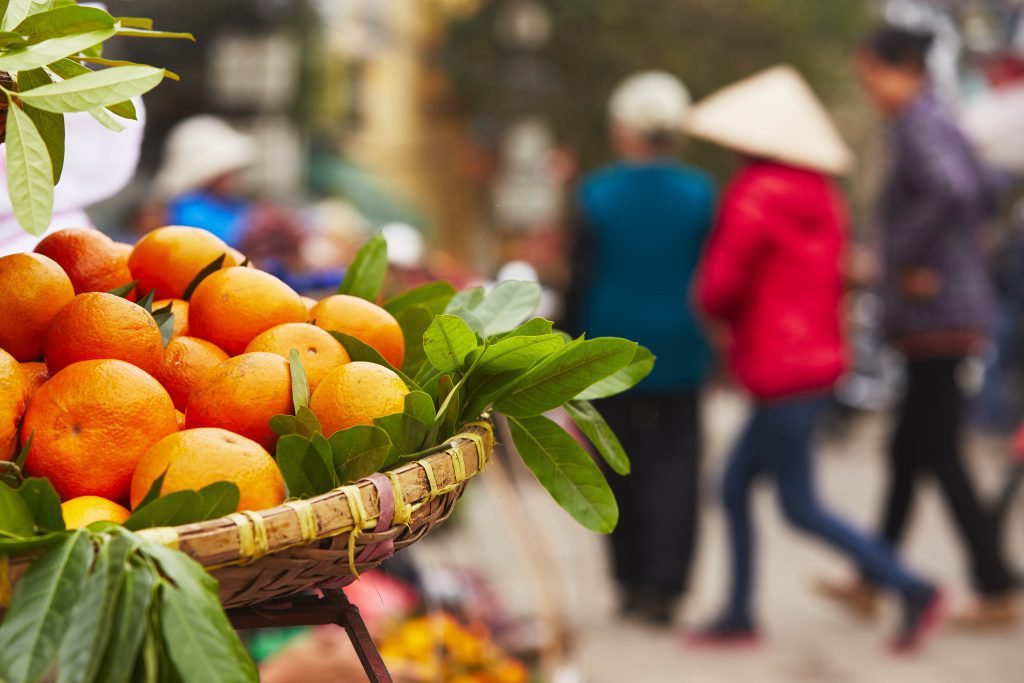 Oranges on the street market in Hanoi - Vietnam